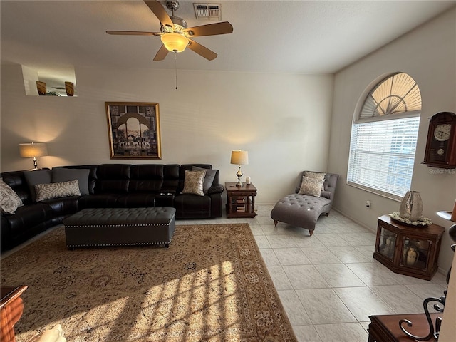 tiled living room with ceiling fan