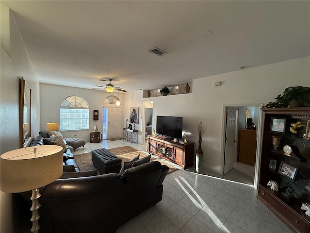 living room with light tile patterned flooring and ceiling fan