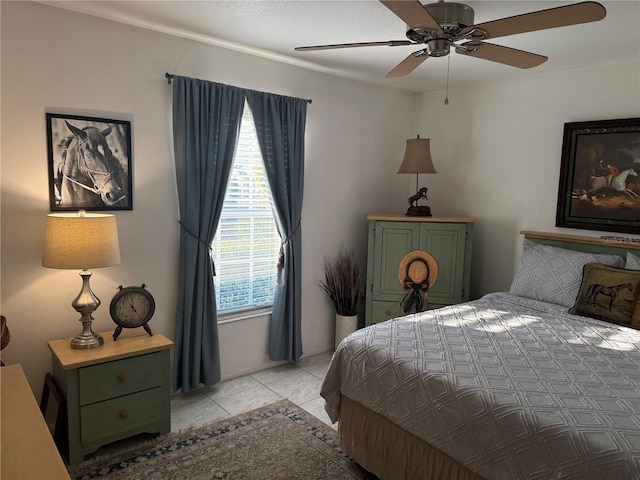 bedroom featuring light tile patterned floors and ceiling fan