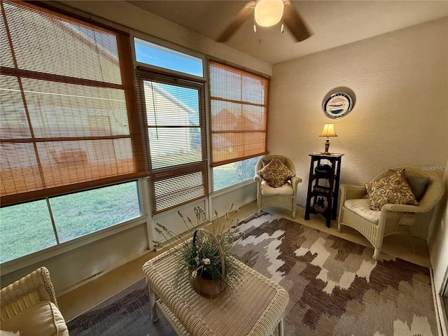 living area featuring ceiling fan