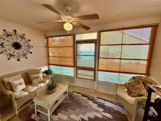 sunroom / solarium with a wealth of natural light and ceiling fan