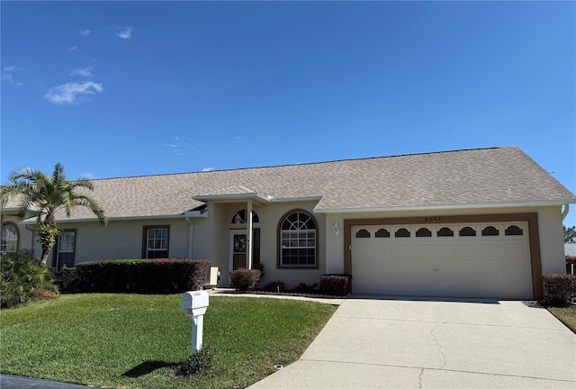 ranch-style house with stucco siding, roof with shingles, concrete driveway, a front yard, and a garage