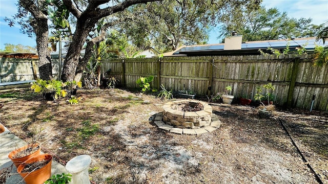 view of yard featuring an outdoor fire pit