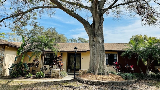 1670 Monterey Dr, Clearwater, FL 33756 - ranch-style house featuring stucco siding and a shingled roof