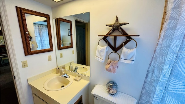 1670 Monterey Dr, Clearwater, FL 33756 - full bathroom featuring toilet, vanity, and a shower with curtain