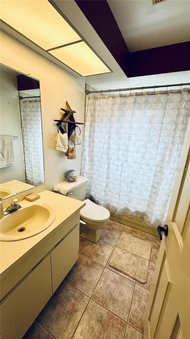 1670 Monterey Dr, Clearwater, FL 33756 - bathroom featuring tile patterned flooring, vanity, toilet, and curtained shower
