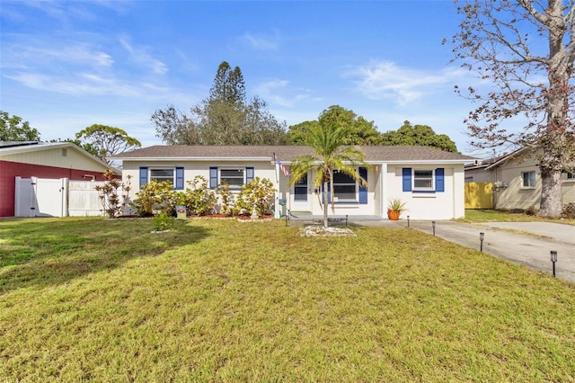 ranch-style house featuring a front lawn