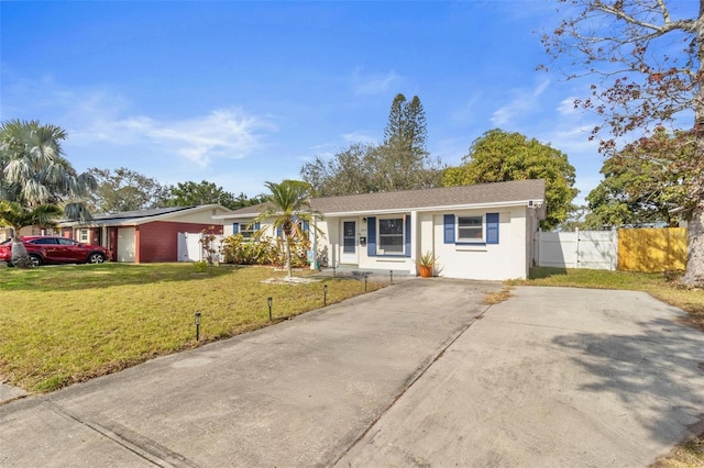 ranch-style home with a front yard