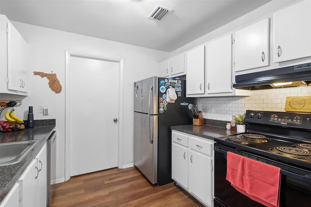 kitchen featuring appliances with stainless steel finishes, dark hardwood / wood-style floors, white cabinetry, sink, and backsplash