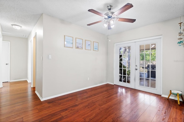 unfurnished room with ceiling fan, hardwood / wood-style floors, a textured ceiling, and french doors