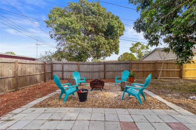 view of patio / terrace with a fire pit