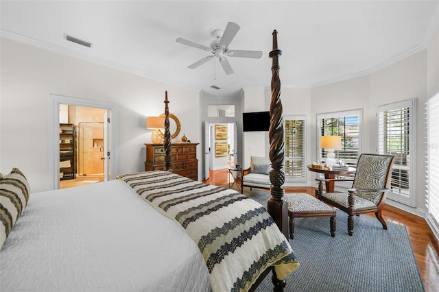 bedroom with ornamental molding, dark hardwood / wood-style floors, and ceiling fan