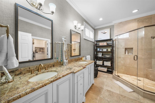 bathroom with ornamental molding, a shower with door, and vanity