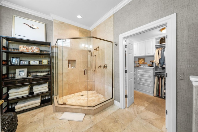 bathroom with crown molding and an enclosed shower