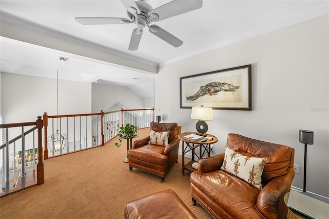 living area with crown molding, carpet floors, ceiling fan, and vaulted ceiling