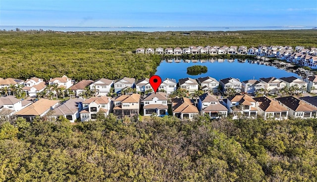 birds eye view of property with a water view