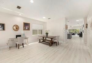 dining room with light hardwood / wood-style flooring