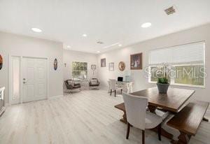 dining space with light wood-type flooring