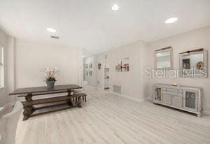 living room with light hardwood / wood-style floors