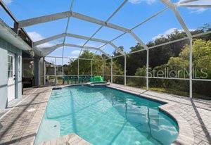 view of pool featuring a lanai