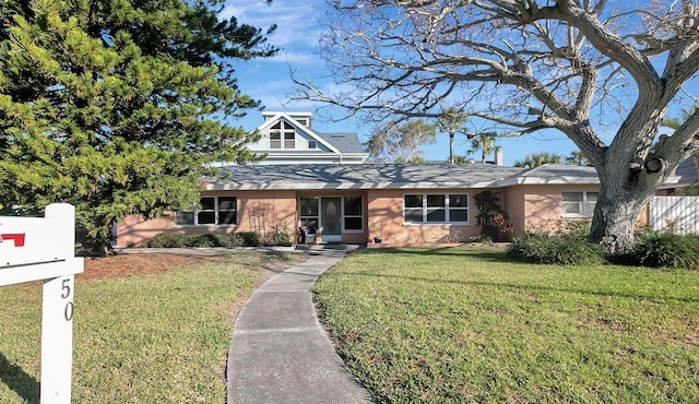 view of front of home with a front lawn