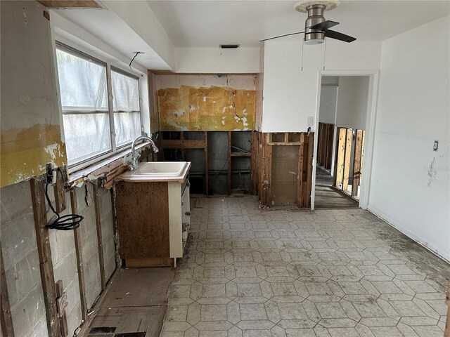 kitchen featuring sink and ceiling fan