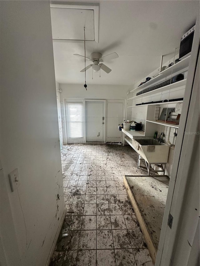 interior space featuring ceiling fan