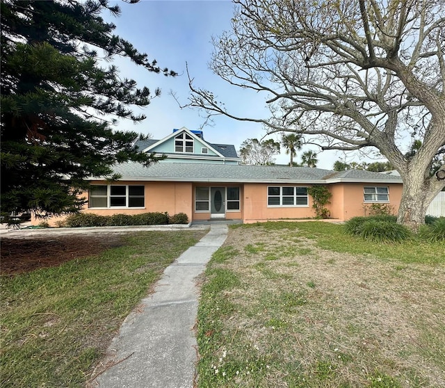 view of front of property with a front lawn