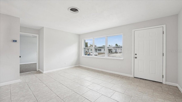 view of tiled spare room