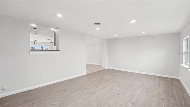 empty room with light wood-type flooring