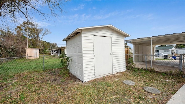 view of outbuilding featuring a yard