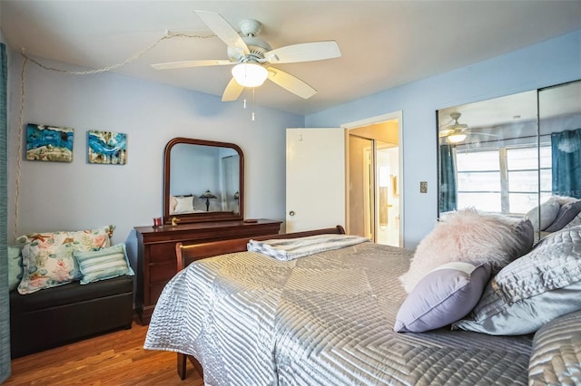 bedroom with hardwood / wood-style flooring and ceiling fan