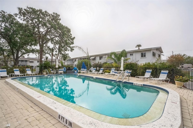 view of pool featuring a patio area