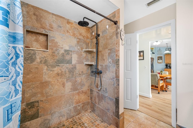 bathroom featuring tile patterned flooring and walk in shower