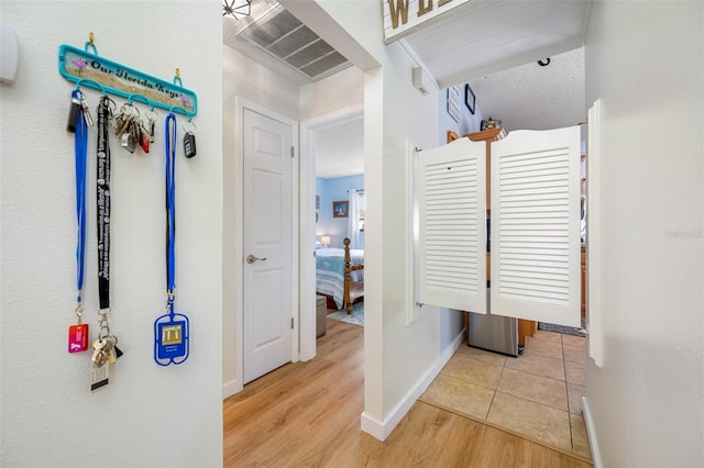 hallway featuring light hardwood / wood-style flooring