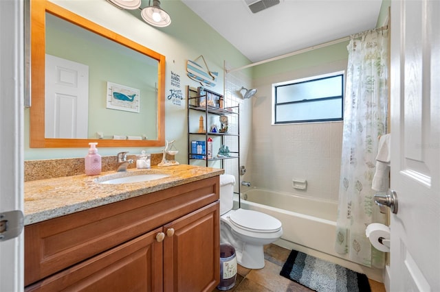 full bathroom featuring toilet, tile patterned floors, vanity, and shower / bathtub combination with curtain