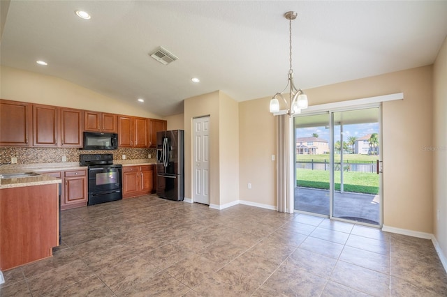 kitchen with visible vents, light countertops, black appliances, tasteful backsplash, and brown cabinetry