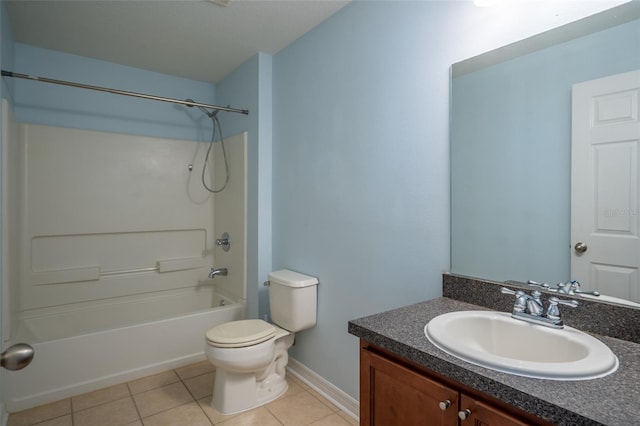 full bath with shower / bath combination, baseboards, toilet, tile patterned floors, and vanity