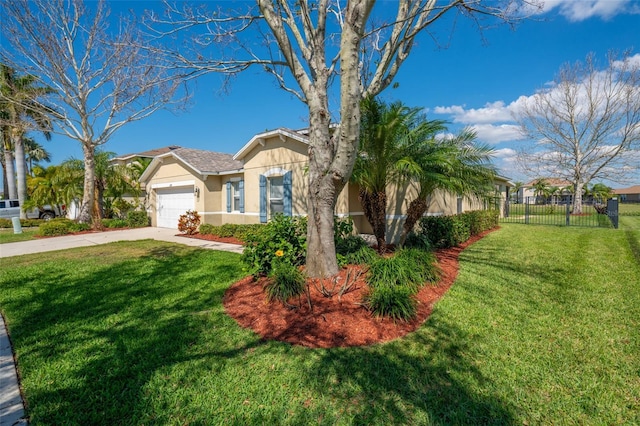 single story home featuring driveway, an attached garage, fence, a front lawn, and stucco siding