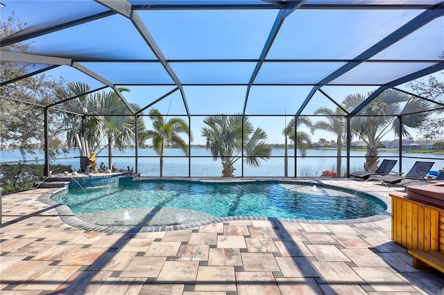 pool featuring a jacuzzi, a water view, a lanai, and a patio area