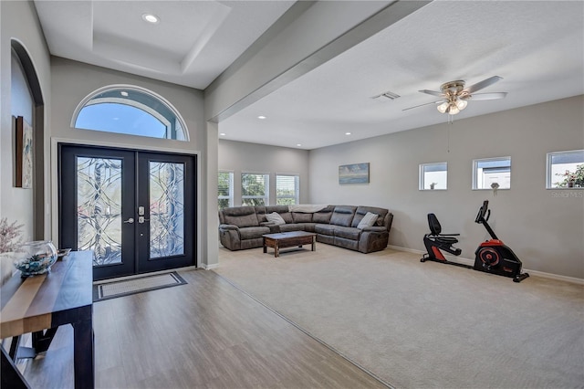 foyer entrance with visible vents, baseboards, recessed lighting, french doors, and wood finished floors