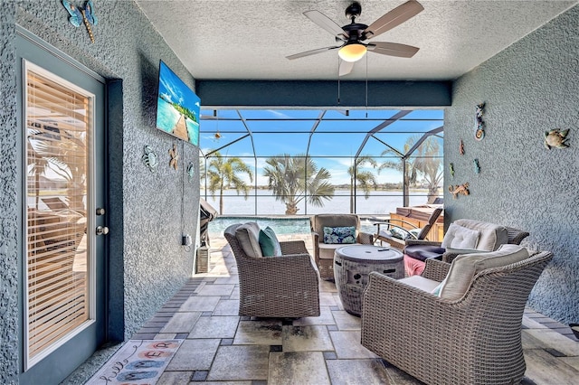 sunroom with a ceiling fan