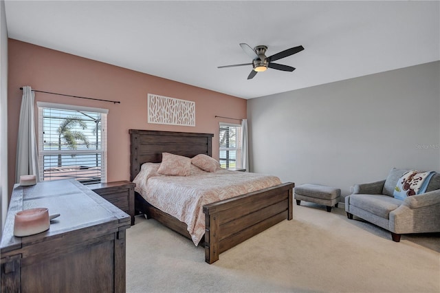 bedroom with light colored carpet and ceiling fan