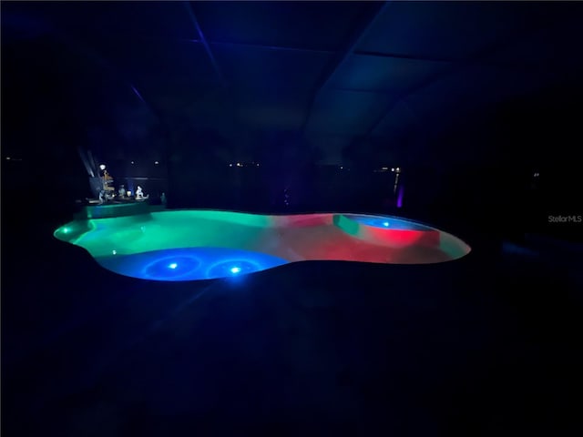 view of pool at night