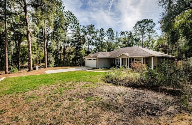 single story home featuring a garage and a front lawn