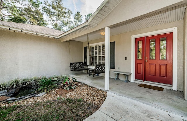 entrance to property with covered porch