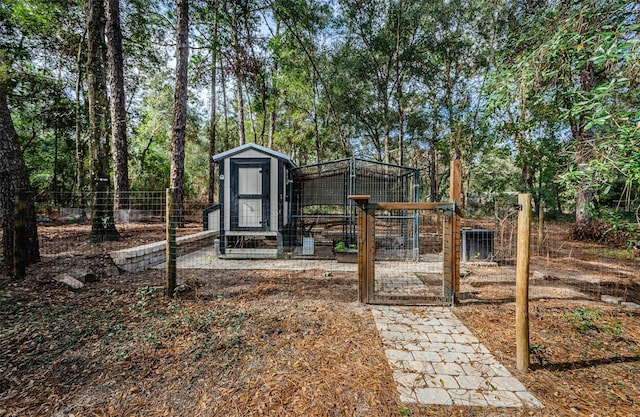 view of yard featuring an outbuilding and central AC unit