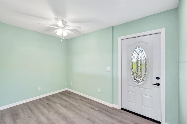 foyer featuring ceiling fan and light wood-type flooring