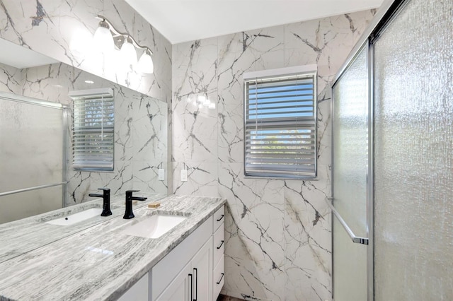 bathroom with walk in shower and vanity