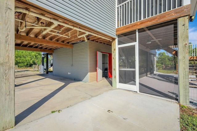 view of patio / terrace featuring a sunroom